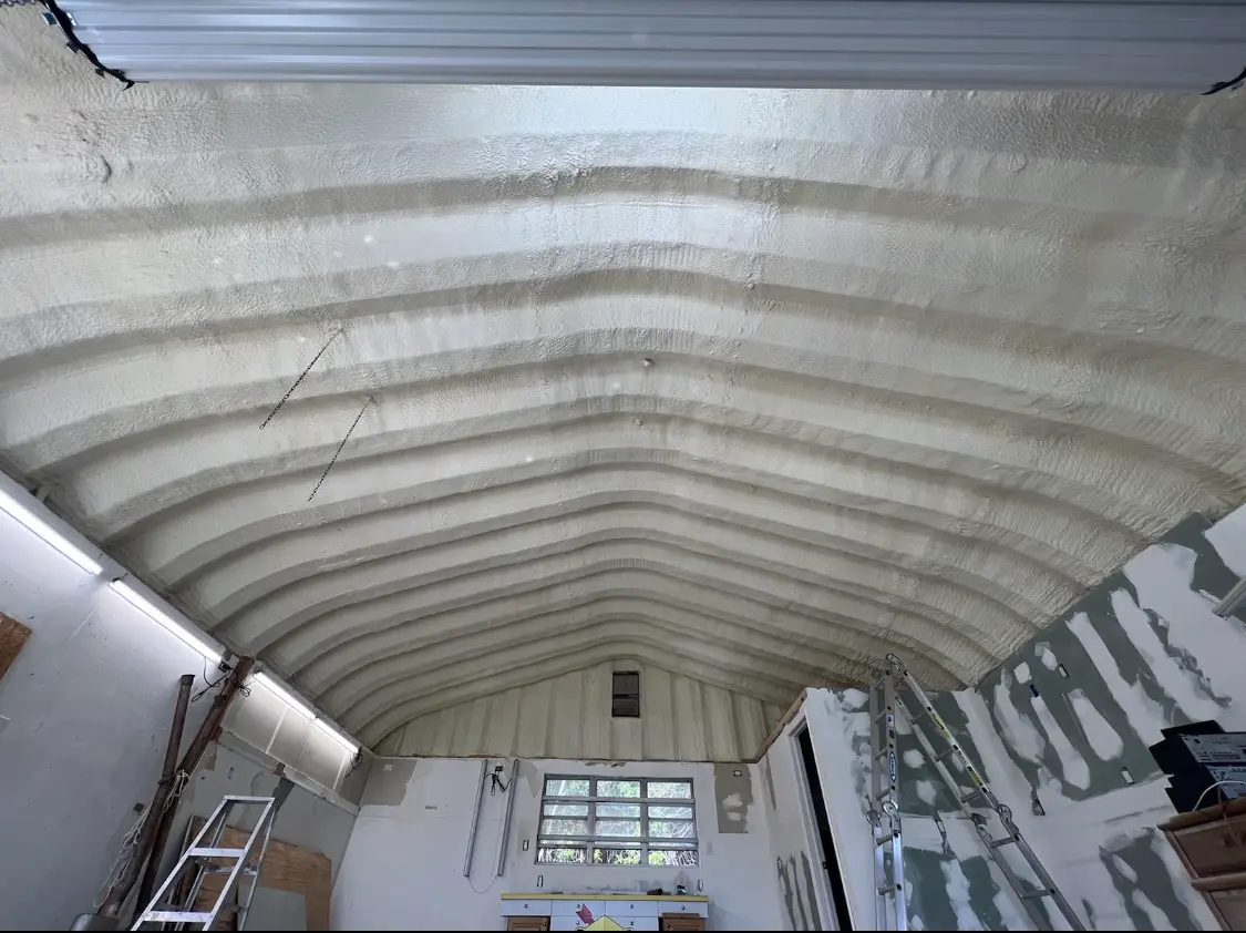 Spray polyurethane foam applied to the underside of a metal roof deck in Elk Ridge